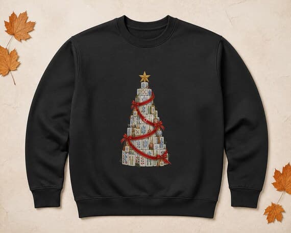 Mahjong tile Christmas tree illustration printed centrally on a black sweatshirt.
